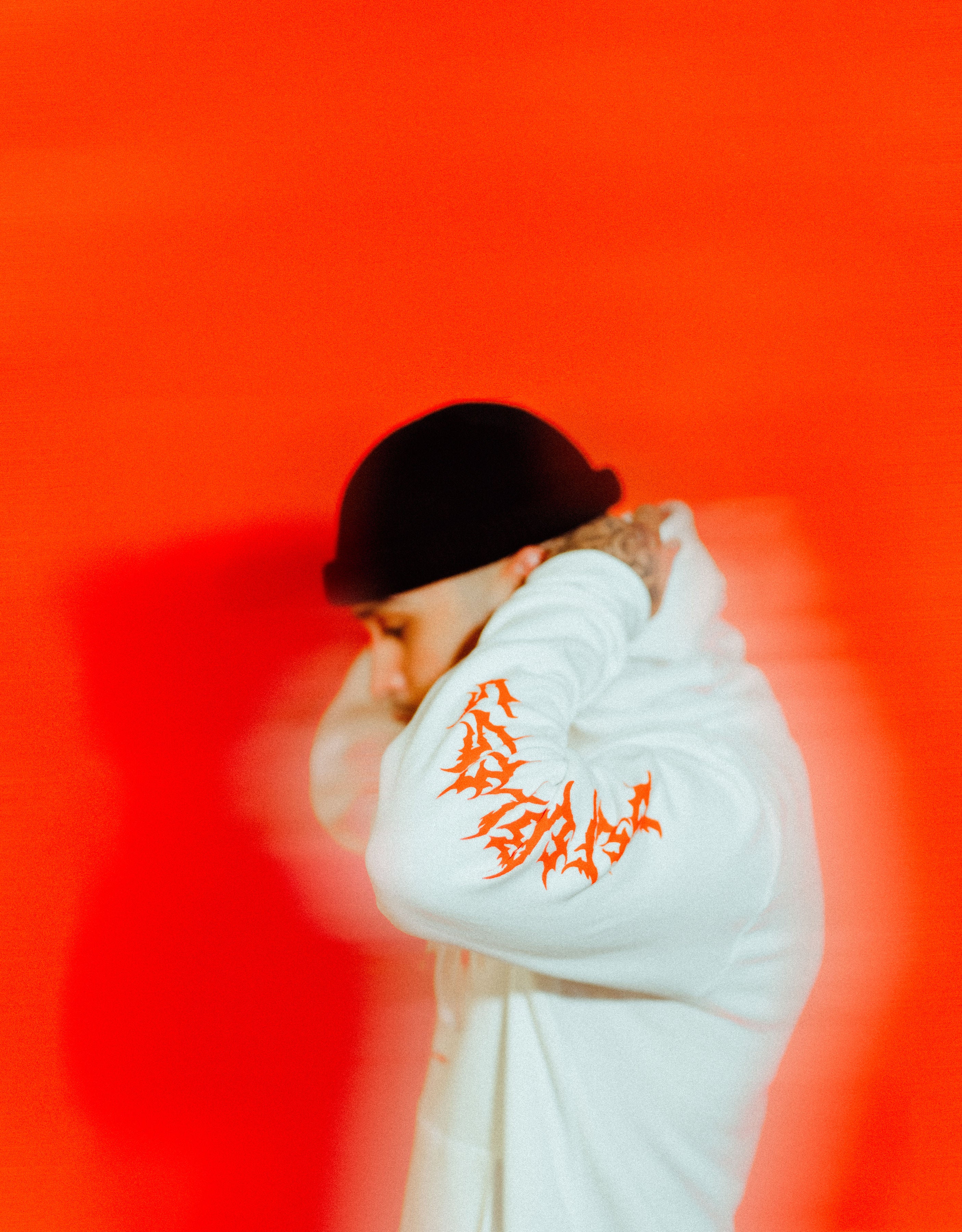 White hoodie with text on sleeve