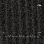 Textured black fabric with a measurement scale at the bottom right corner